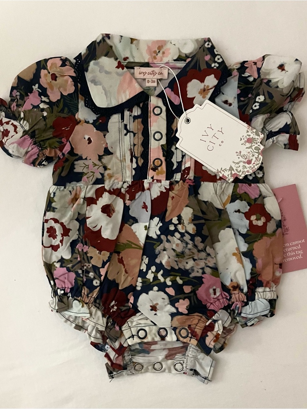 Floral bubble with button down front and lace trim